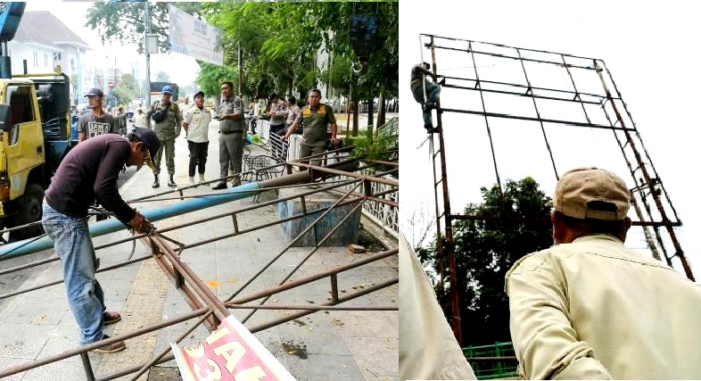 Satpol PP Siantar Bongkar Dua  Papan Reklamae Tanpa Izin
